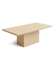 Side-top perspective of Enzo Dining Table showing Crema Marfil marble with chipped edge and rectangular base