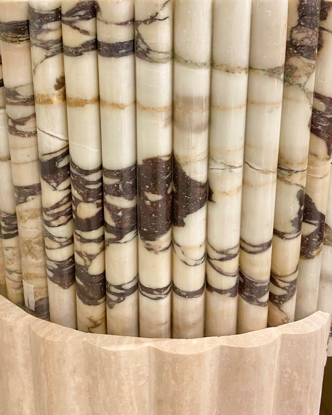 Detail of filled travertine base with rounded strips