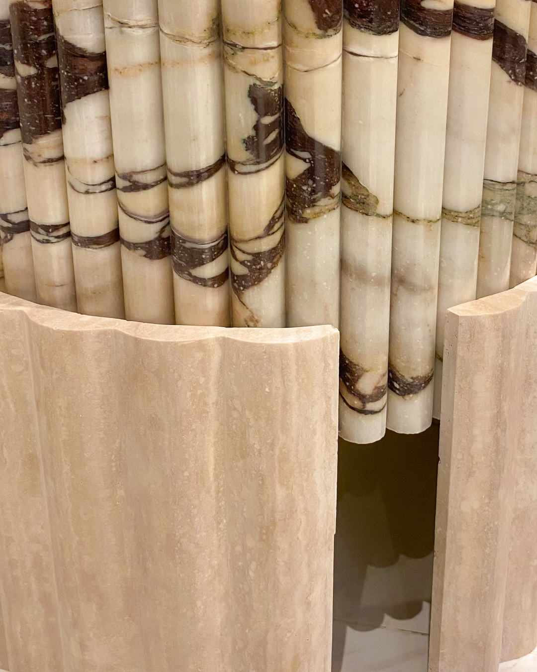 Texture detail showing contrasting marble and travertine finishes