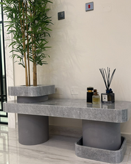Frontal angle view showing marble collar planter structure
