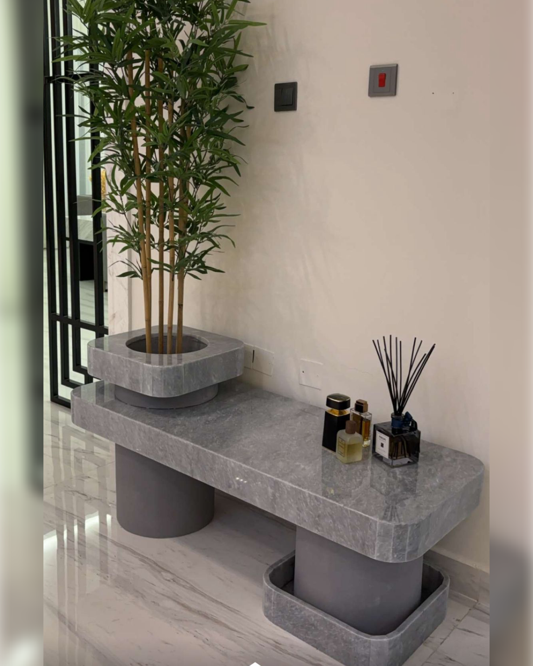 Top view of Tundra Grey marble with visible veining and central planter cutout