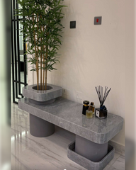 Top view of Tundra Grey marble with visible veining and central planter cutout
