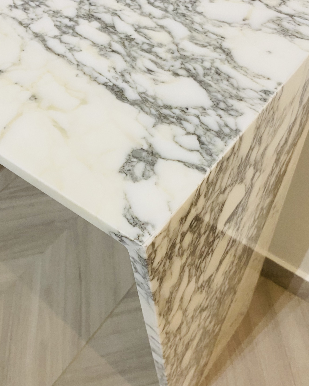 Soft lighting accentuating marble veining and polish