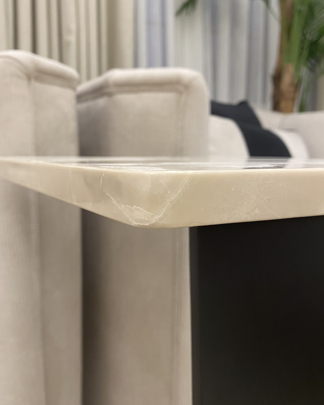  Close-up side view of Sweet Cream marble edge with polished finish and rounded corner detailing