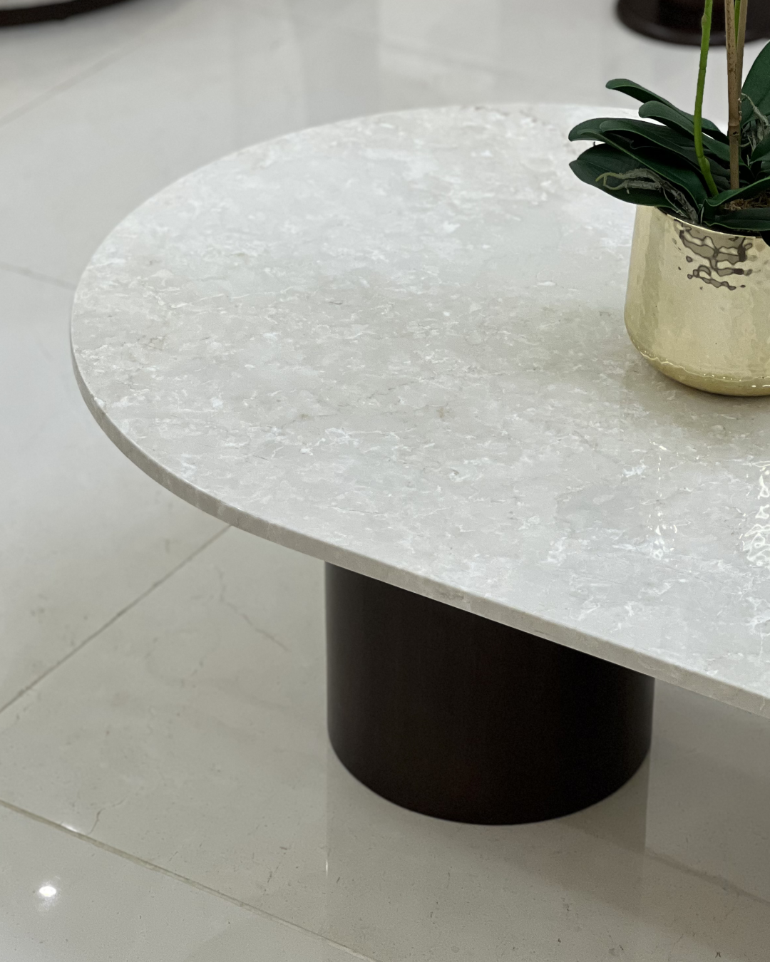 Close-up of marble top and walnut-toned wood grain