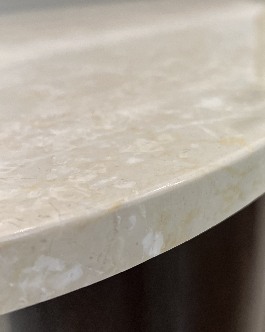 Close-up of Botticino marble top surface edge finishing