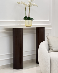 Styled behind a sofa in an entryway setting