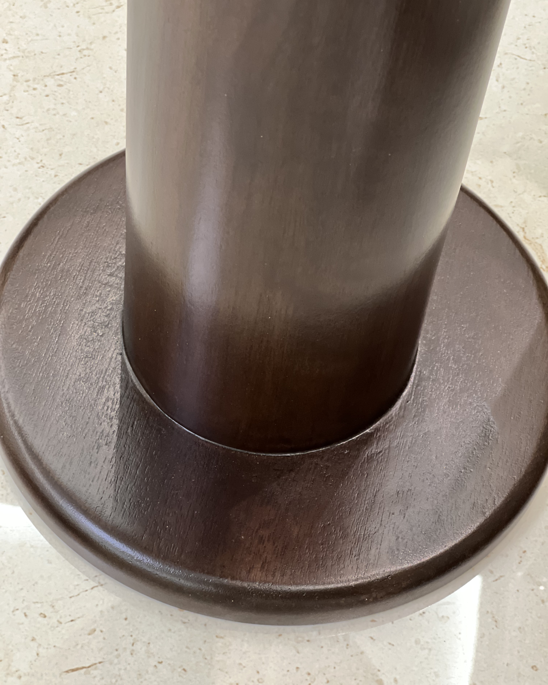 Detail of walnut-finished wooden base