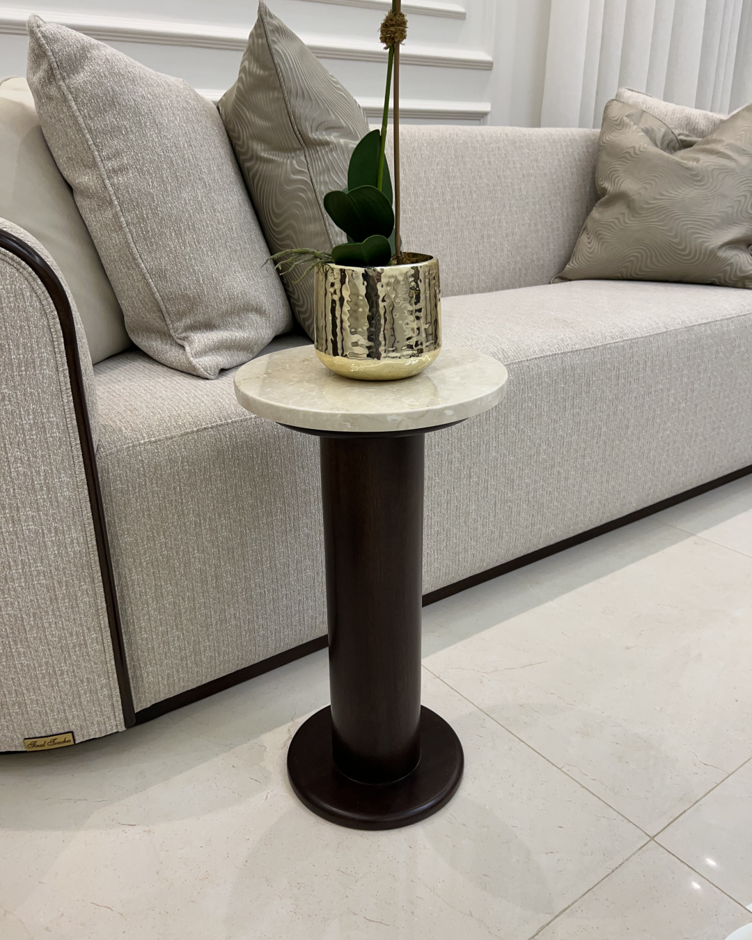 Styled in front of sofa in lounge setting