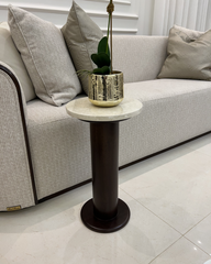 Styled in front of sofa in lounge setting