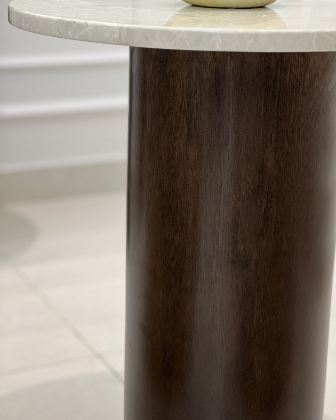 Detail of walnut wood grain on cylindrical base