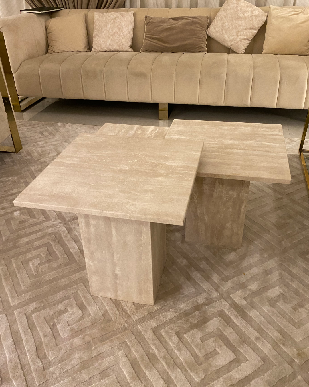 Angled view of Marea Coffee Table Set showing the boxed bases and clean edge profiles