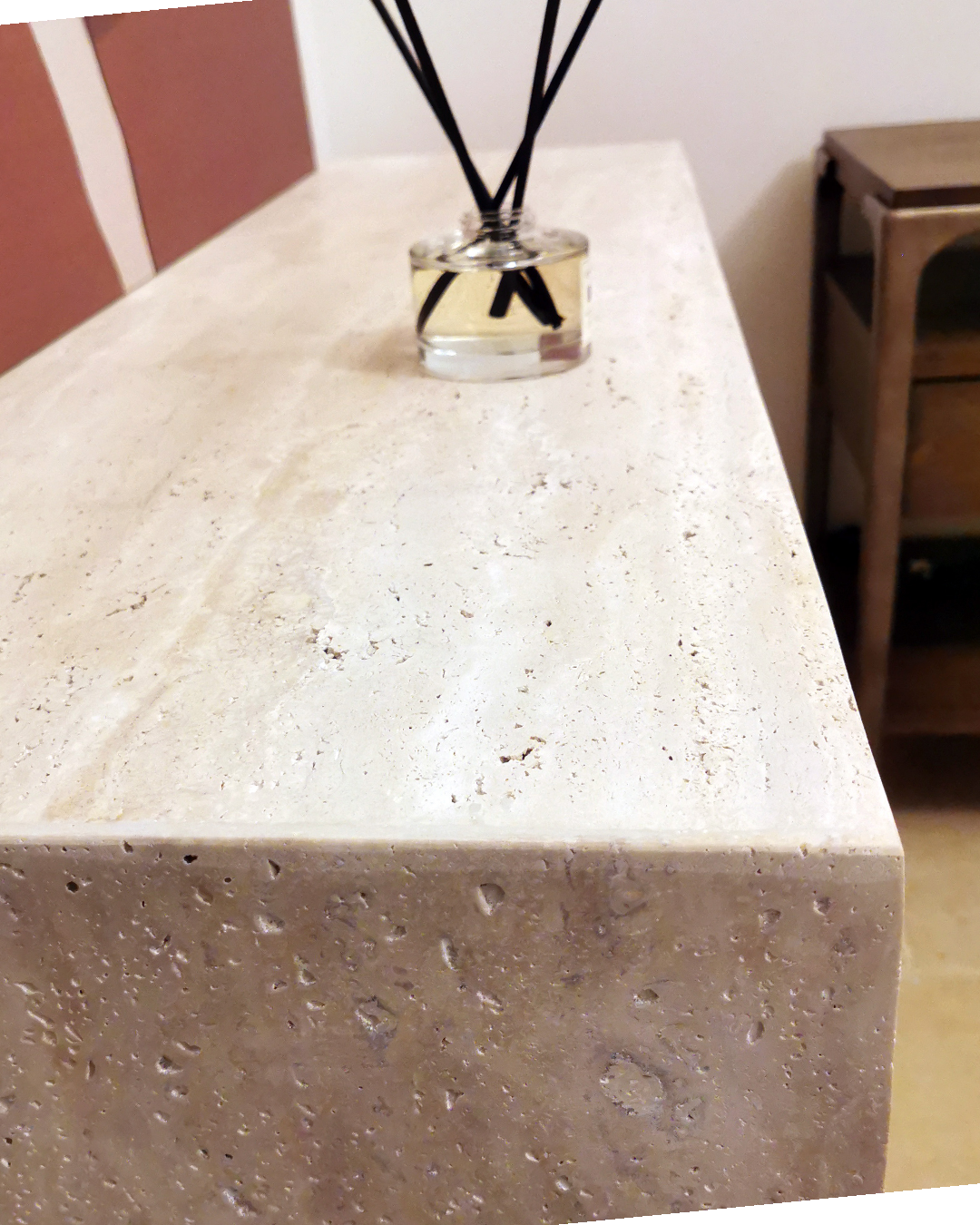Angled view of Mira Console Table showing stone thickness and clean geometry