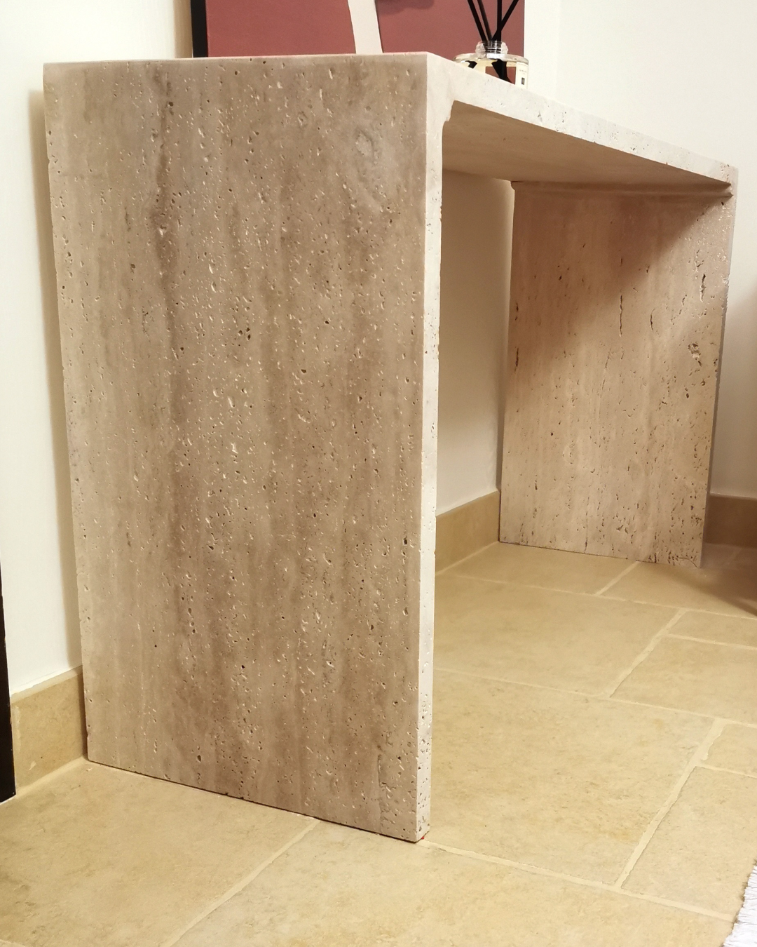 Side perspective highlighting marble pores and leg thickness