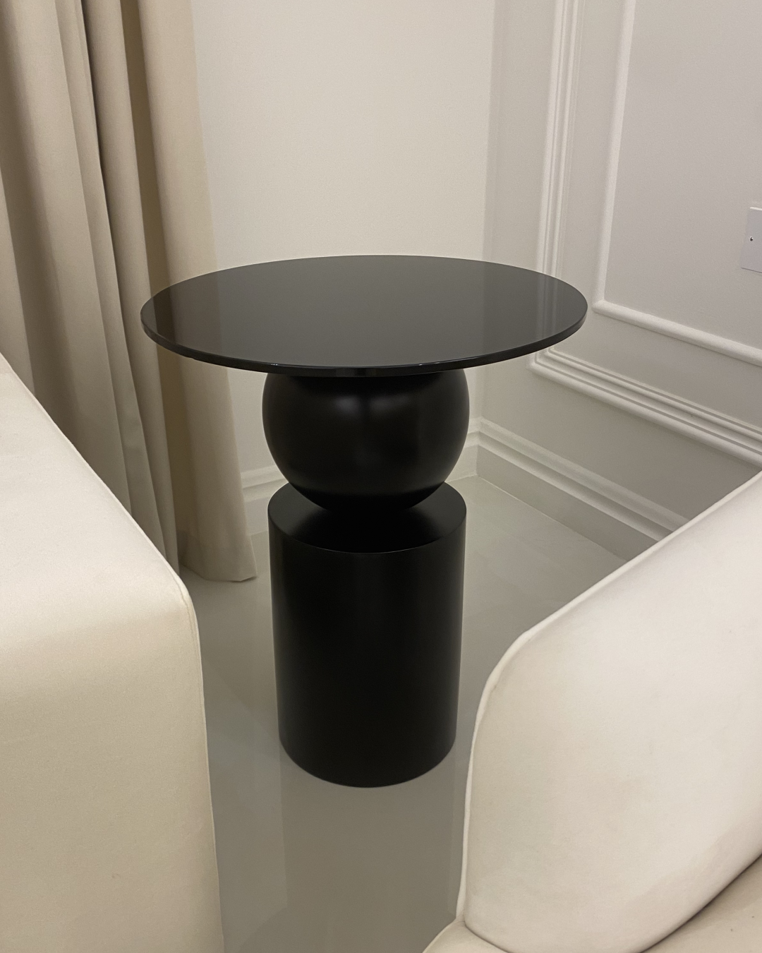 Nero Side Table styled in bedroom corner beside modern sofa