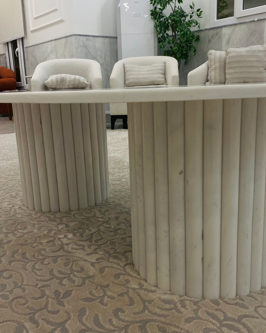 Close-up of vertically fluted marble cylindrical base