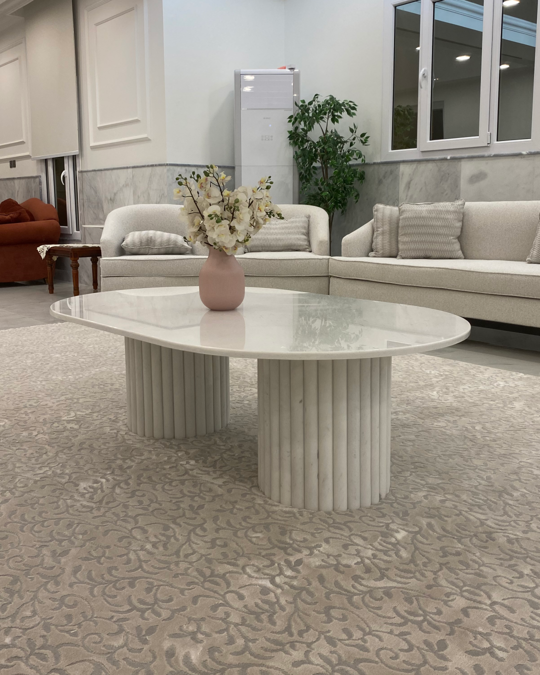 Full view of Nova Coffee Table with capsule marble top and fluted bases