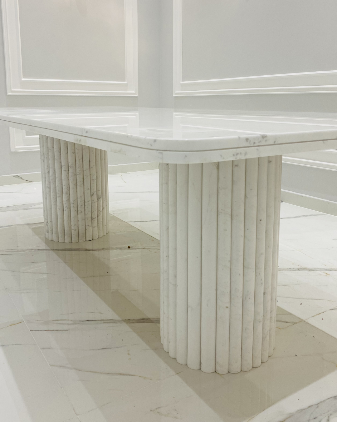 Cylindrical fluted bases crafted from marble strips