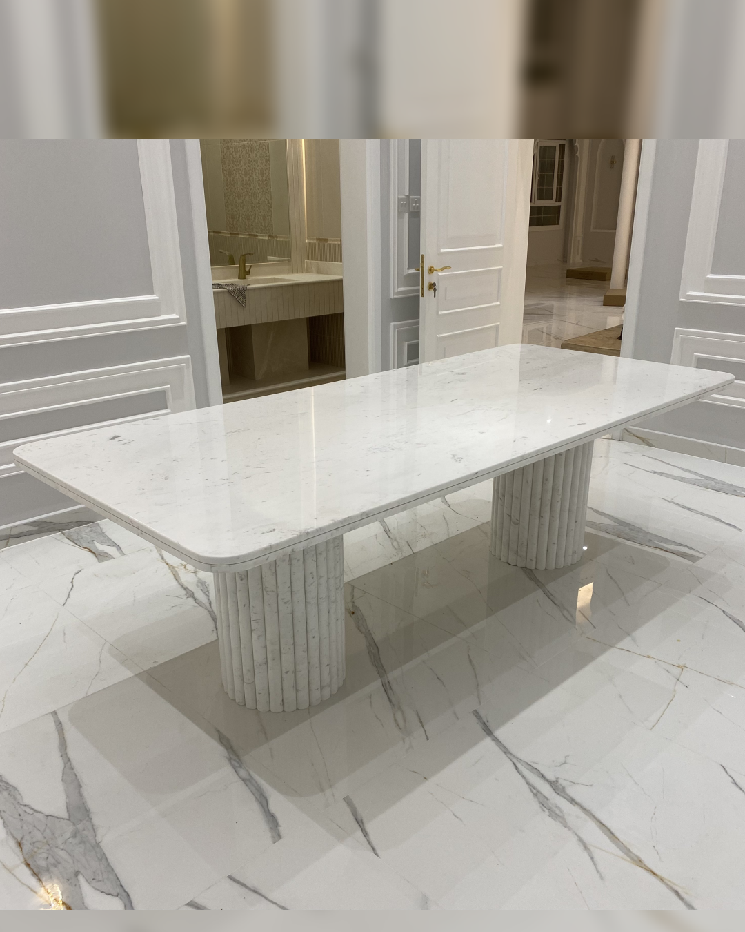 Full view of Nova Dining Table in Polaris marble with fluted column bases