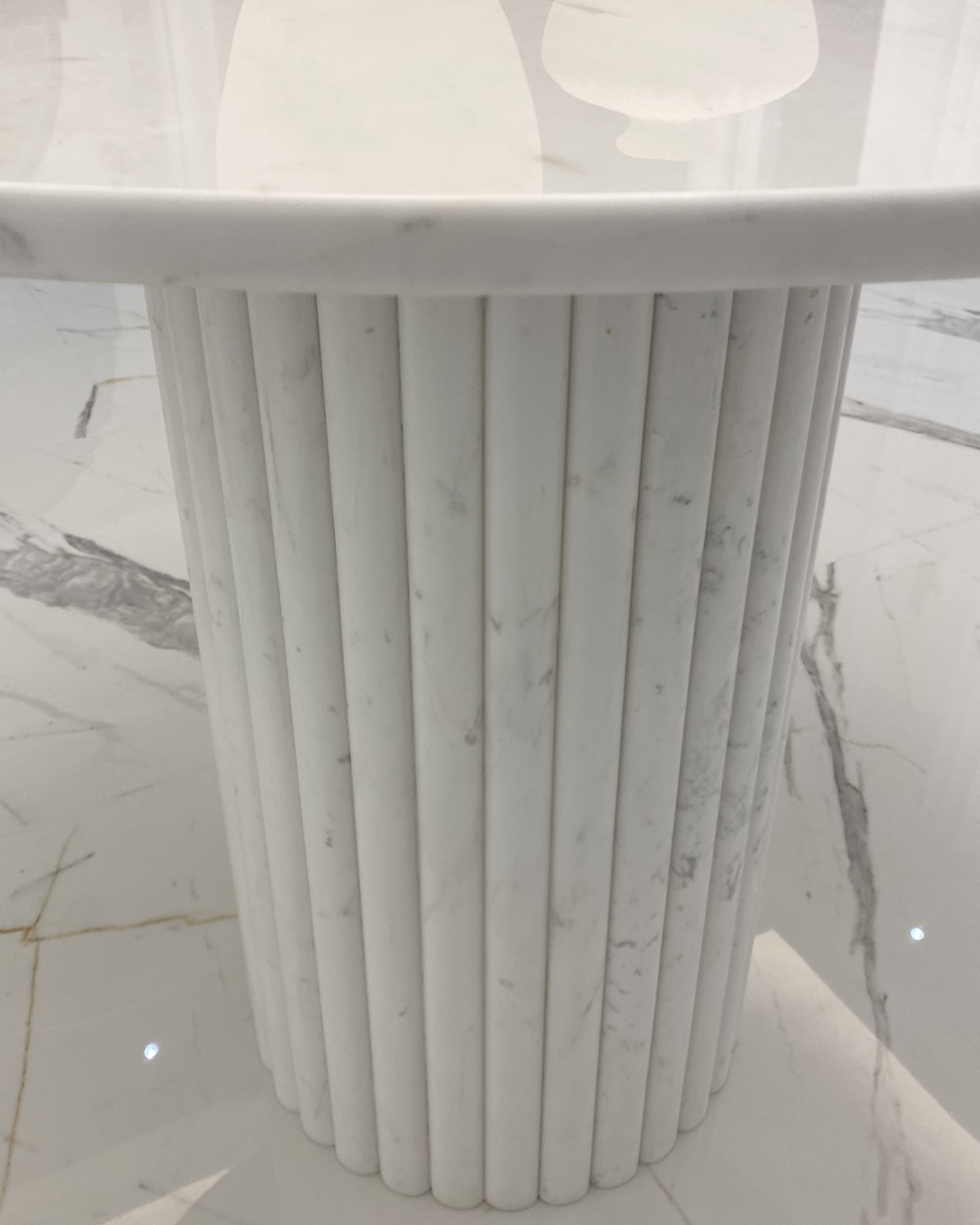 Close-up of fluted cylindrical marble base