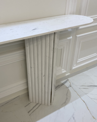 Detail of fluted and flat marble base panels