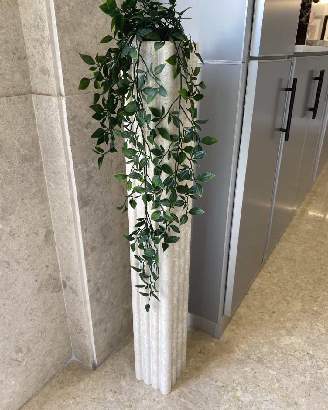 Orma Planter styled in a corner hallway with natural light