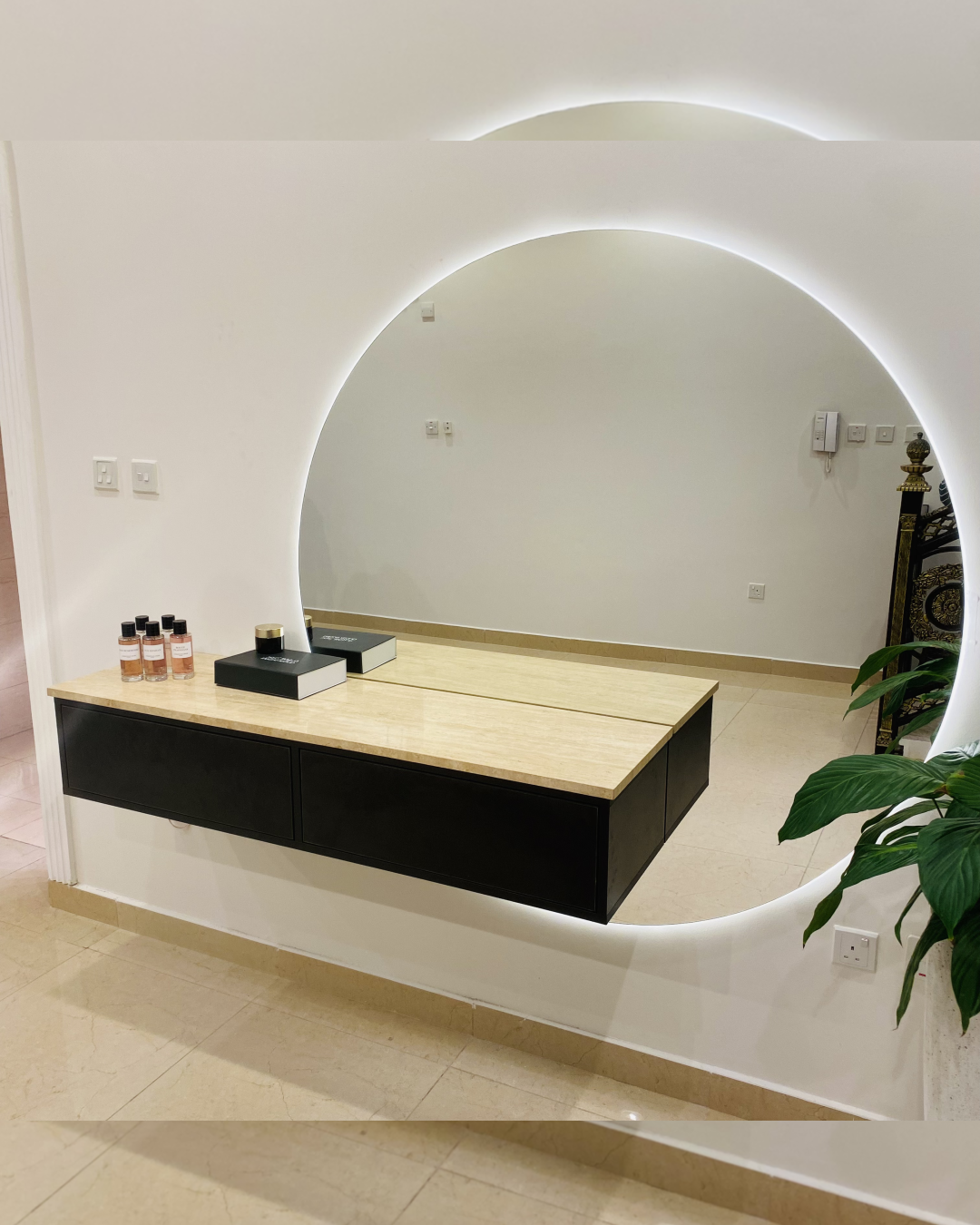 Main view of Prismo Vanity Console showing floating travertine top with circular LED mirror