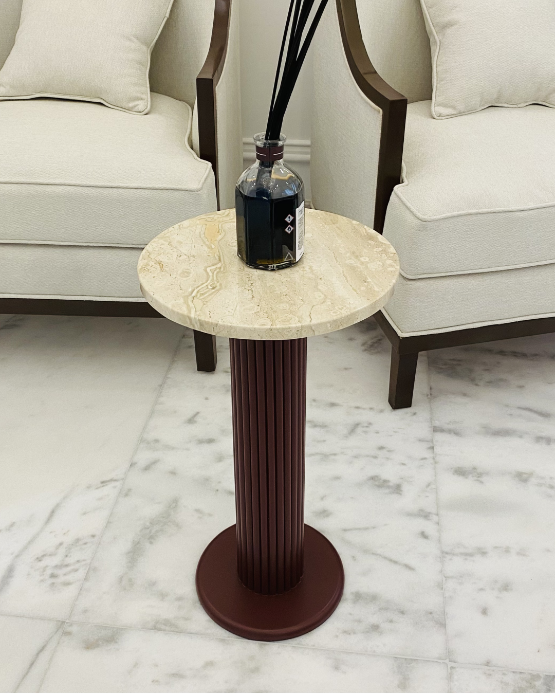 Full view of Raqia Serving Table with round marble top and fluted wood base