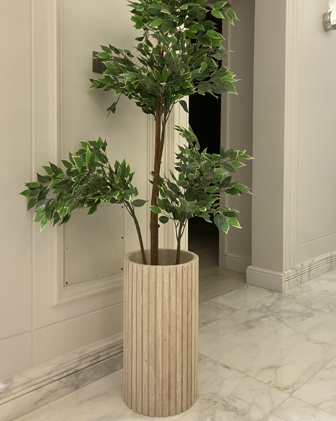 Frontal view of vertical grooved travertine pattern