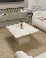 Main view of Revya Coffee Table featuring square Royal Dino marble top and chipped edges