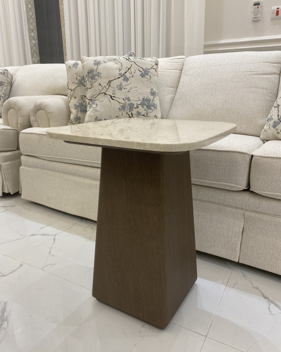 Rowa Side Table styled beside a lounge chair