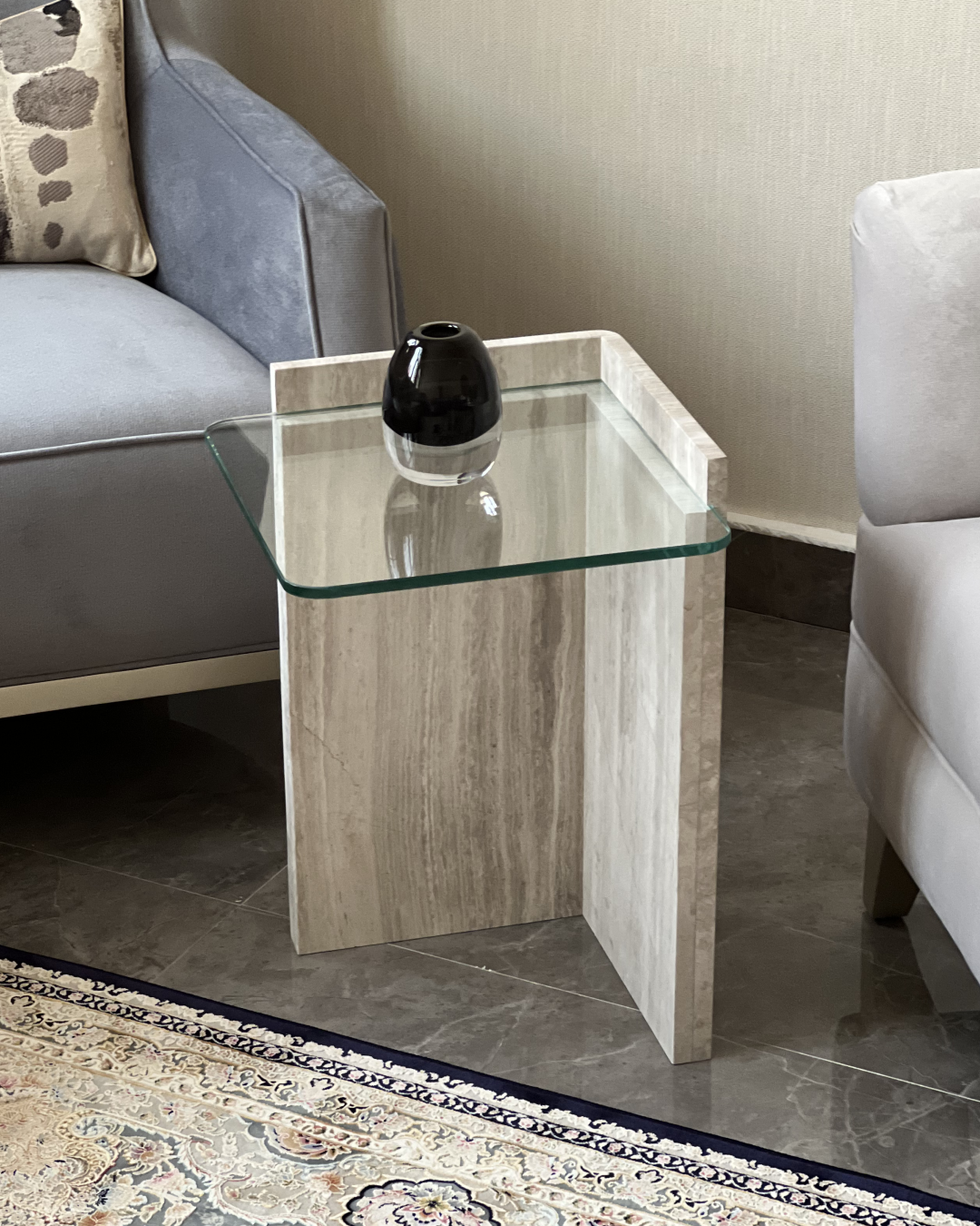 Full view of Safa Side Table with square glass top and L-shaped marble base