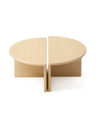 Savora Coffee Table set with no background, showing two modular travertine halves forming a full circular top with soft shadows beneath