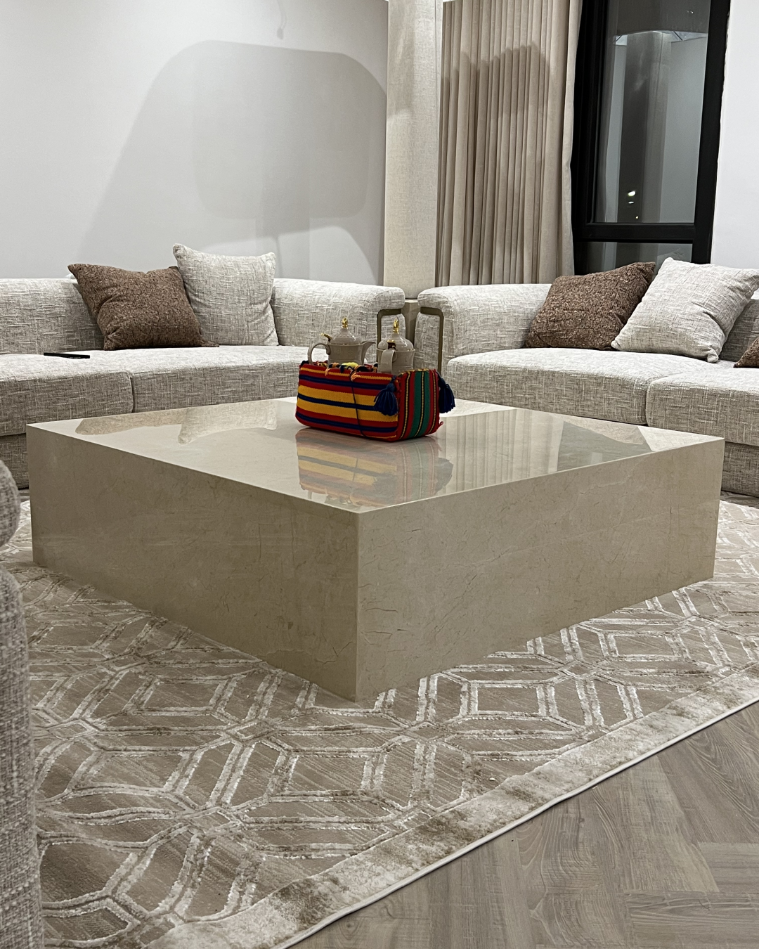 Solano Coffee Table full view in marble-finished lounge