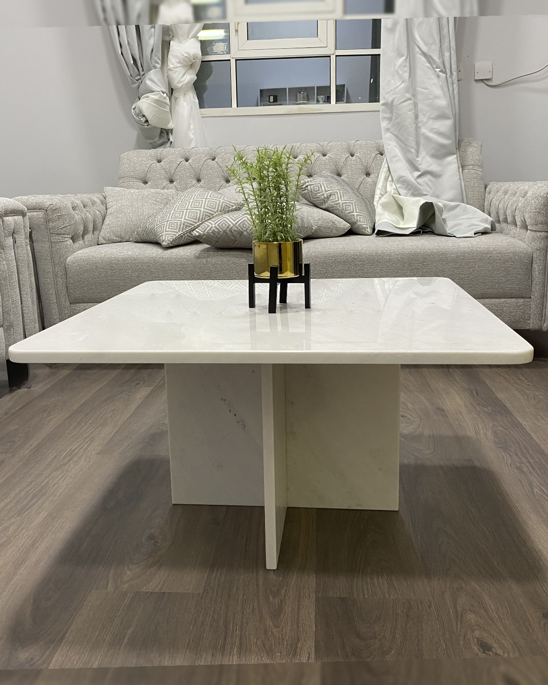 Side profile of Tara Coffee Table showing 2cm thick marble top and intersecting base
