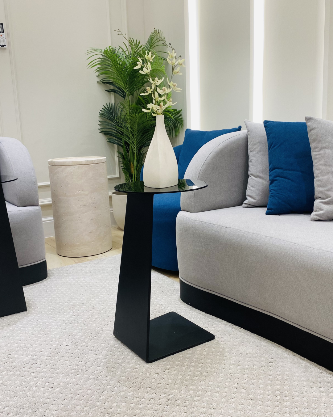 Travea Serving Table styled beside modern sofa