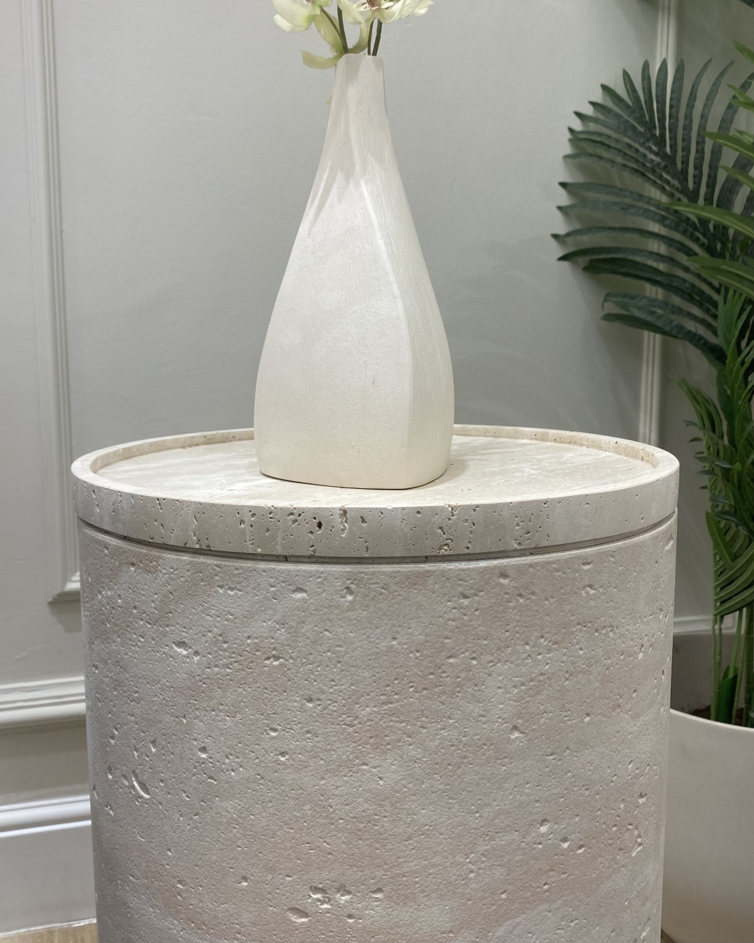 Close-up of dipped travertine top and honed surface