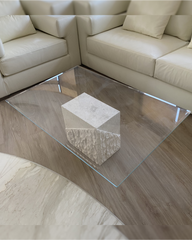 Top-down view of beveled glass top and centered stone base