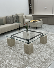 Side angle showcasing beveled glass and black frame of the Vetro Coffee Table