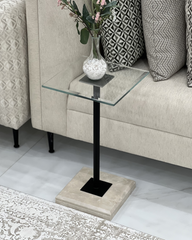 Full view of Vetro Serving Table with clear glass top, black pole, and marble base
