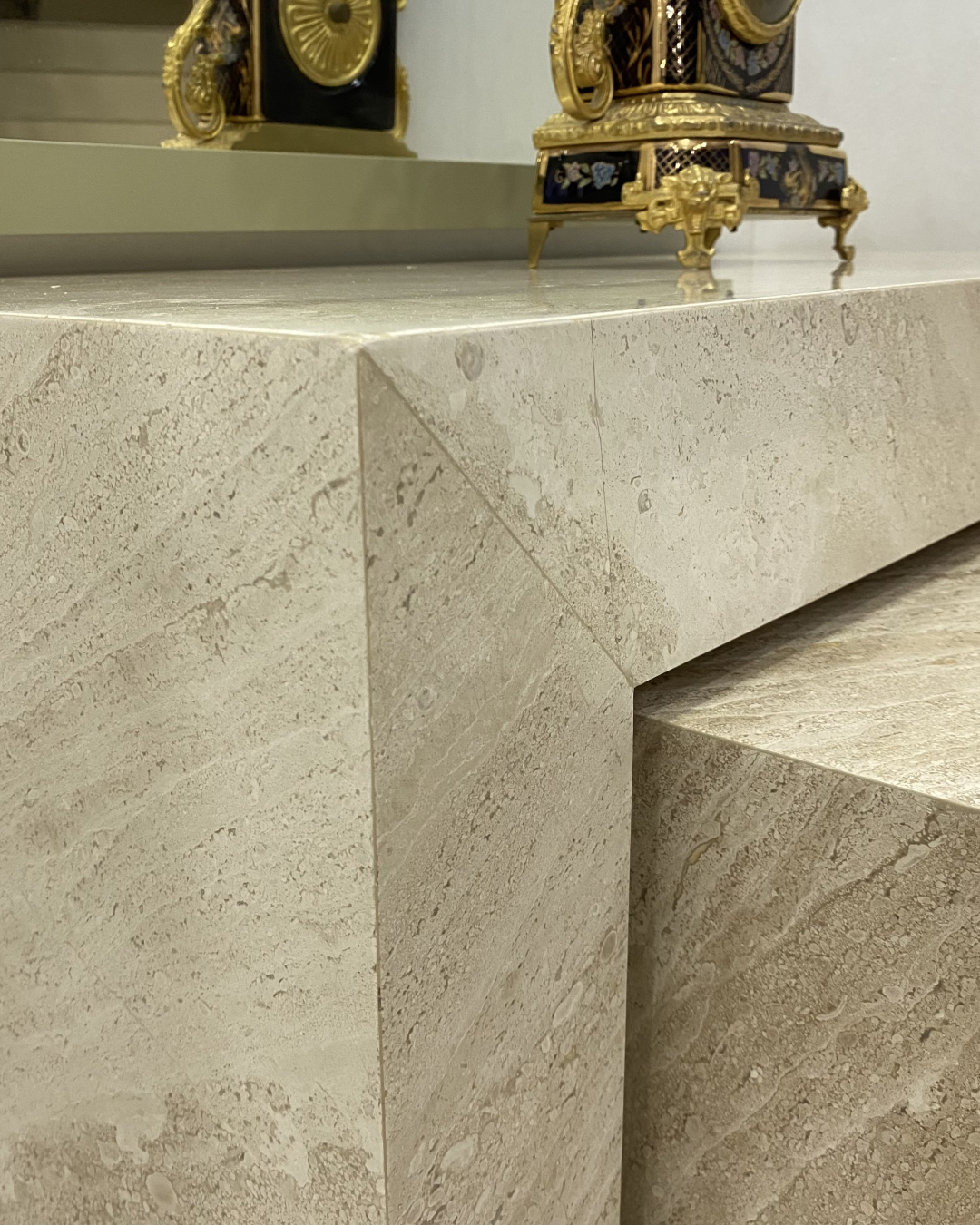 Close-up of corner finishing showing seamless marble joints and handcrafted edge