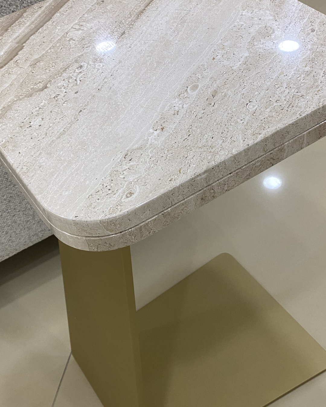 Top-down view showing square marble top with veining