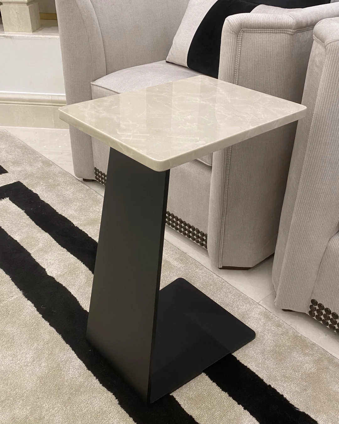 Front view showing rectangular marble top and C-shaped base