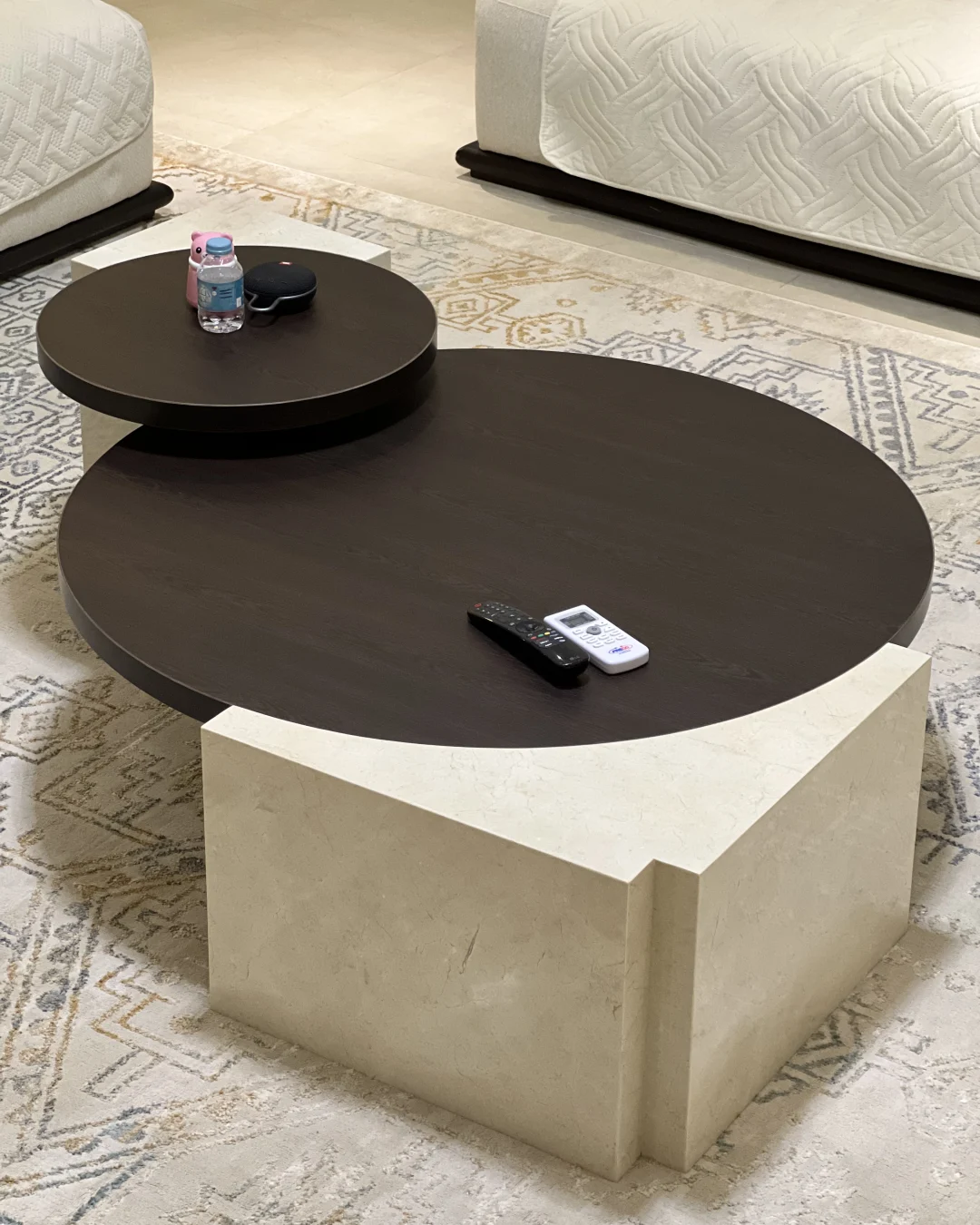 Angled perspective showing depth and positioning of both nested tables