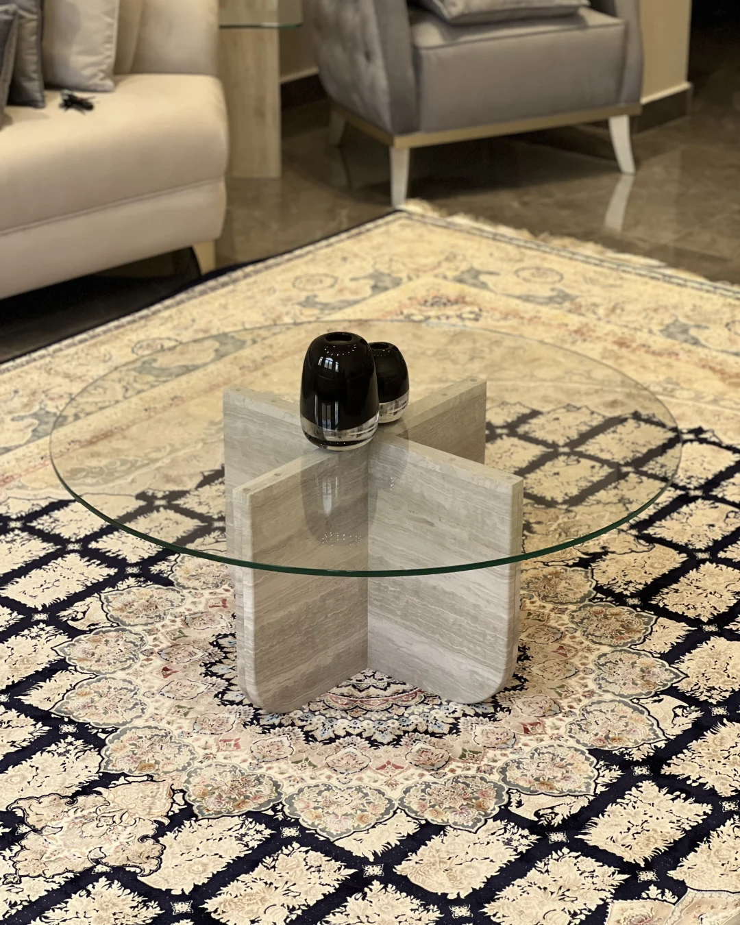 Full view of Safa Coffee Table showing round glass top and White Wood Marble cross-base