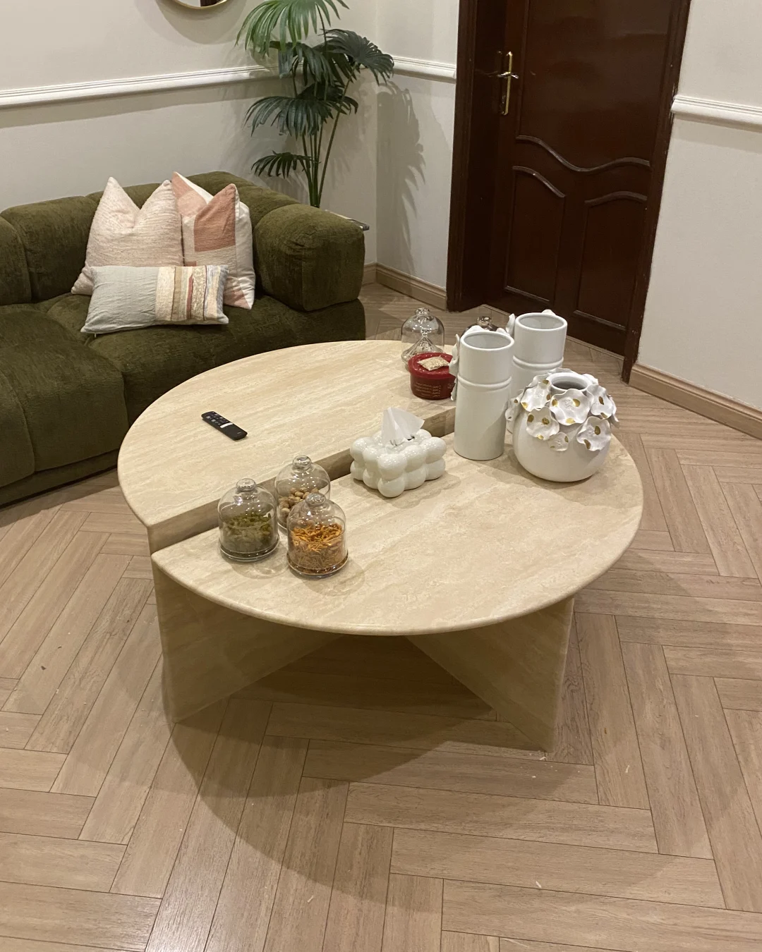 Front view of Savora Coffee Table showing two-piece travertine form and stepped height