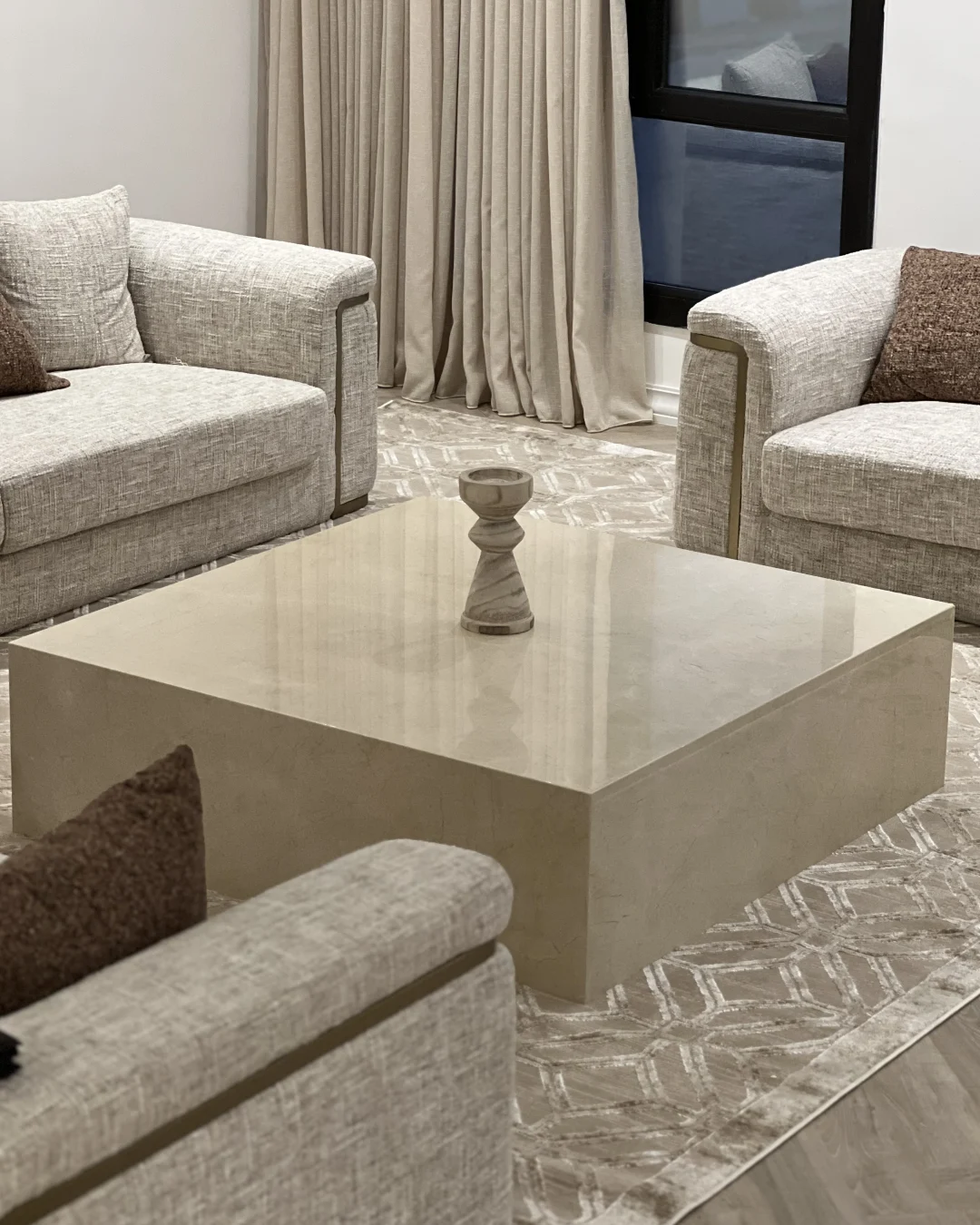 Angled view of Solano Coffee Table showing square marble form and beveled edges