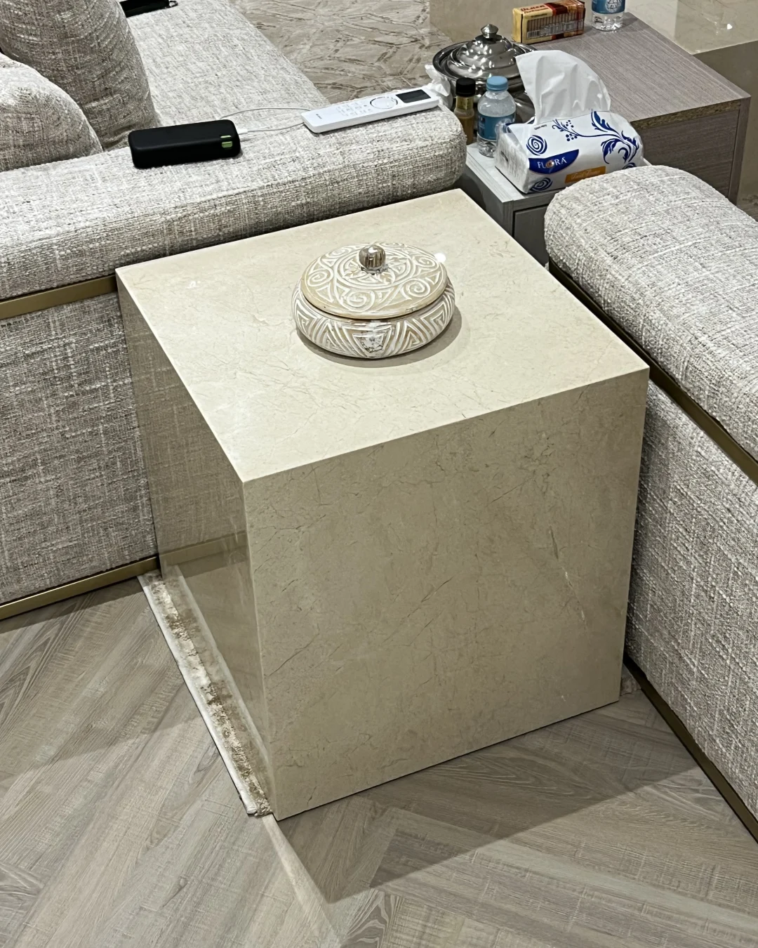 Solano Side Table placed beside a sofa as a compact marble accent table