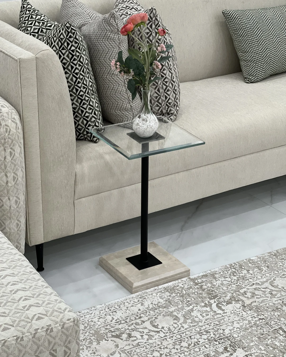 Table styled beside sofa in Majlis setup with light décor